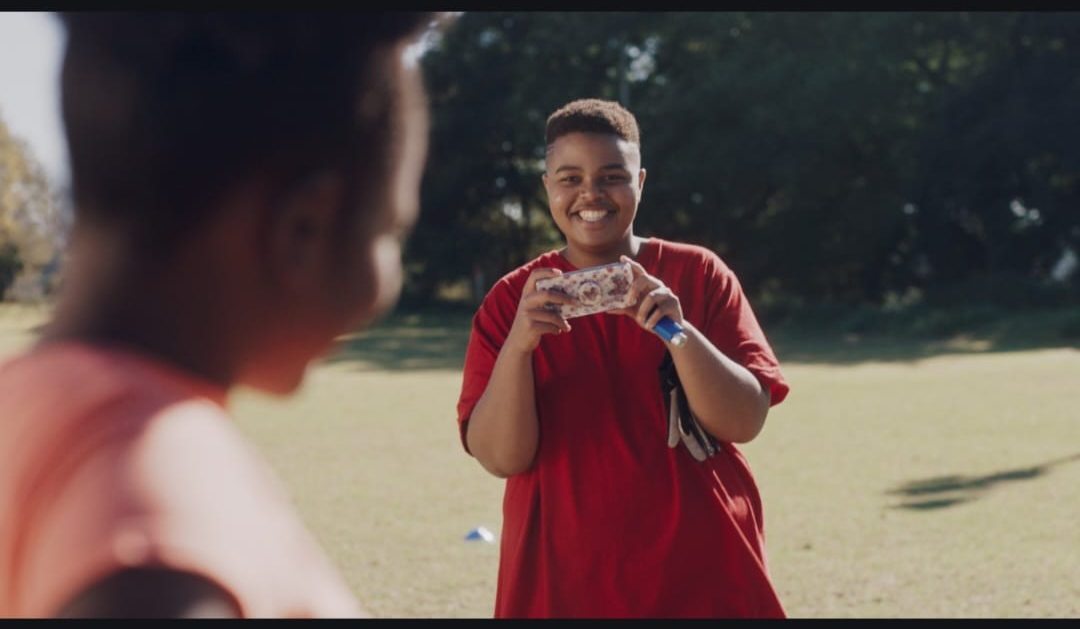 ZA Mvubelo as Muzi in a scene on location